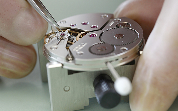 Mechanical wristwatch being repaired
