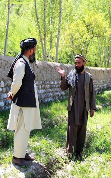 Mawlawi Abdul Qahar (L), head of Tolo Fruit Cooperative visiting the fruit nursery of Sarajuddin pictured (R)