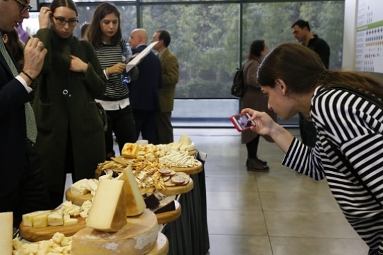 guests try milk products produced by project beneficiaries