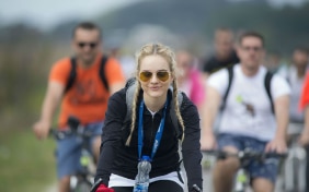 A young girl in a bicycle 