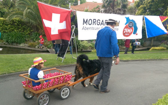 Bernese mountain dog with cart for children 