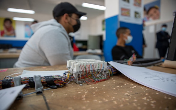 A group of Palestine refugee students in one of UNRWA’s TVET centers in the West Bank. Students are attending a newly introduced course on smart-home technologies funded by Switzerland.