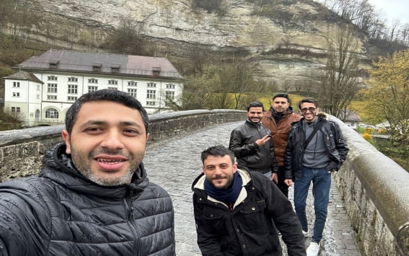 Gazan interns on medieval bridge in Fribourg