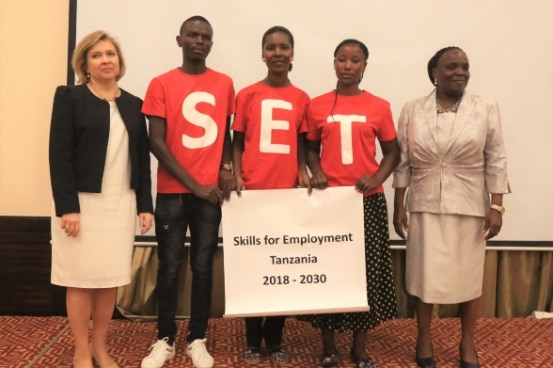From left: Swiss Ambassador Florence Tinguely Mattli, youth from the Swiss-funded OYE project and Minister for Education Prof. Joyce Ndalichako at the SET launch.