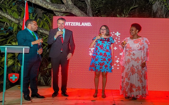 From L - R: Minister Nchemba, Ambassador Chassot, Mrs. Joëlle Chassot and Mrs. Neema Nchemba toast to good health and prosperity.