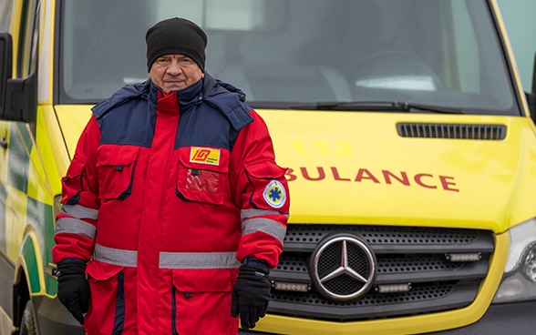 A medical worker near an ambulance