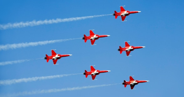 six fighter jets in flight formation