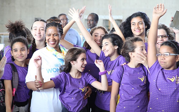 UN Women Executive Director Phumzile Mlambo-Ngcuka with a group of young girls.
