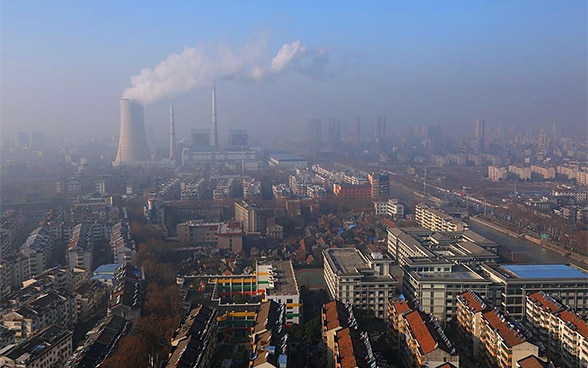 A thick cloud of smoke rises from a factory in Huai’an City in eastern China.