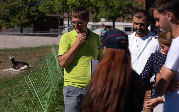 A man is speaking to a group.