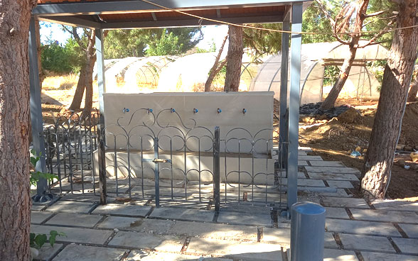 A public fountain with solar panels in a small community in Majdaloune. Several of these were built as part of the SDC project.