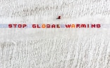 A long strip, one metre by 50 metres, laid out on the Aletsch glacier to form the message 'Stop global warming', made up of more than 2,500 postcards drawn and written on by children and young people.