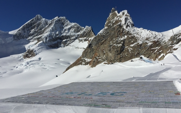 The individual postcards were assembled on a glacier to form one big postcard.