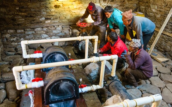 A local community is trained in the use of a micro power plant.