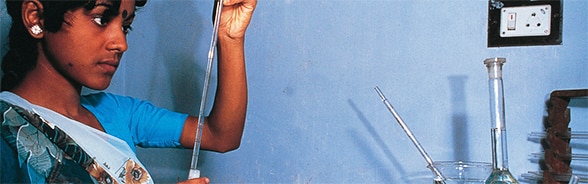 A young woman working in a laboratory in Bangladesh in 2012