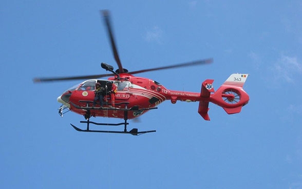 Operating the winches during a flight with pilots in the Romanian air rescue service