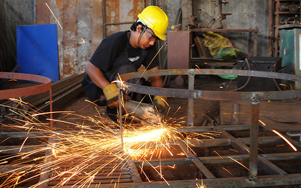 A young man welding in Nepal. 