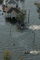 Aerial shot of flooding in the United States. People can be seen travelling around in boates.