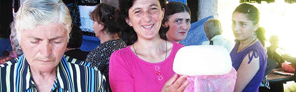 Young farmers sell their cream cheese at the local market