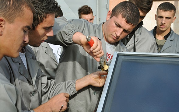 Apprentices in Albania working on a thermo-hydraulic machine