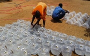  People being provided with water from a tank in South Sudan