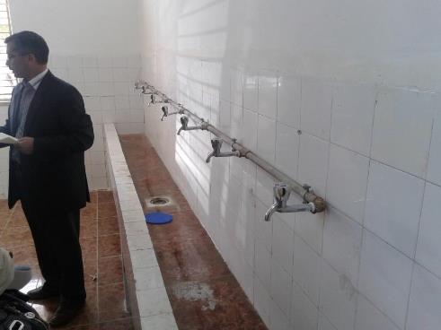 a man standing in front the new taps 