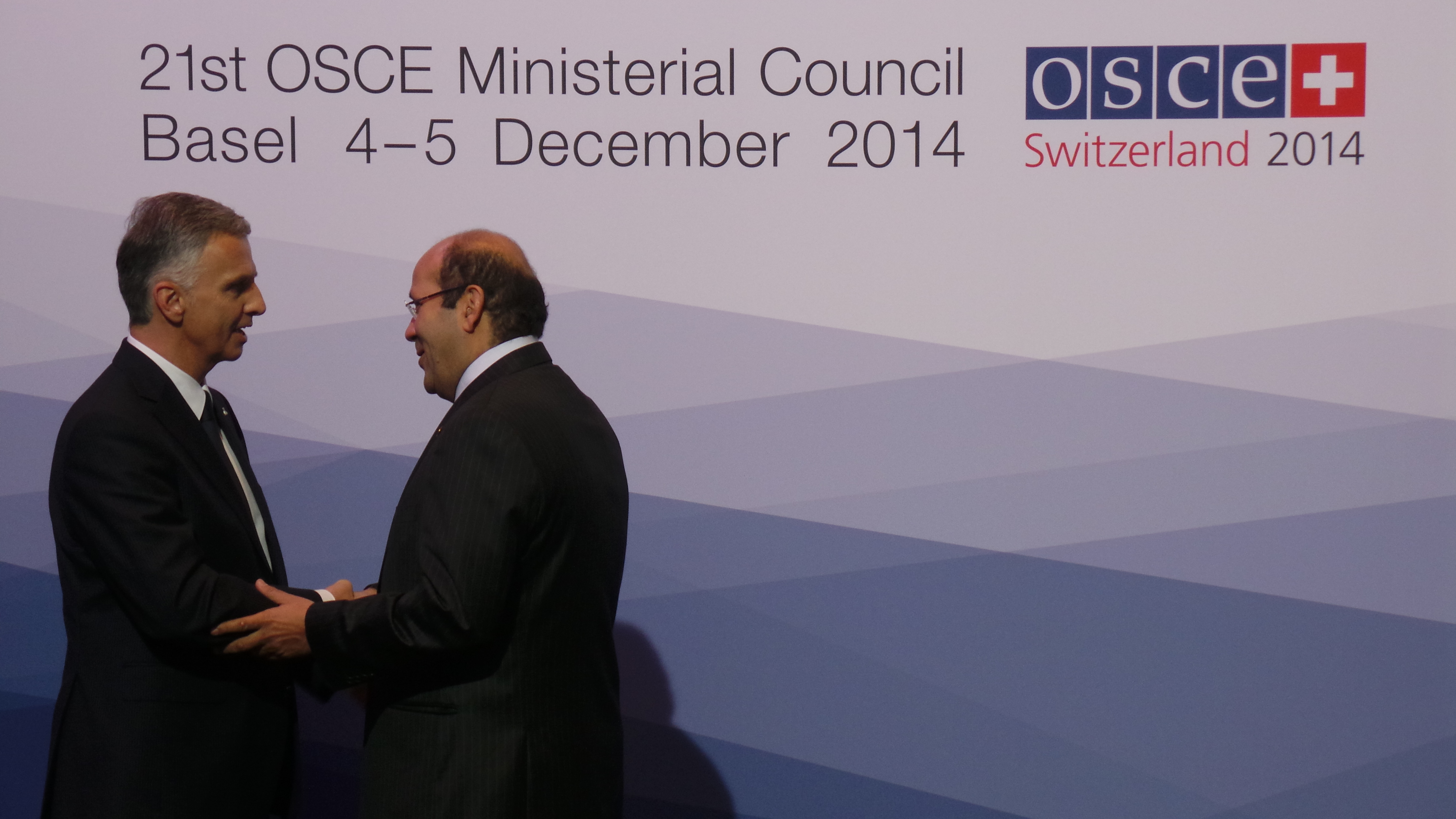 The President of the Swiss Confederation, Didier Burkhalter, greets Hisham Badr, Assistant Minister for Multilateral affairs and international security in Egypt at the OSCE Ministerial Council 2014 in Basel