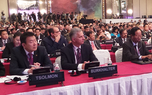 Federal Councillor Didier Burkhalter listening during a plenary session of the Shangri-La Dialogue in Singapore.