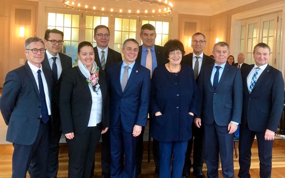 Federal Councillor Ignazio Cassis with the heads of government of the International Lake Constance Conference in a brightly lit room. 