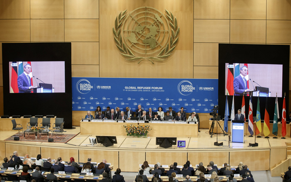 Swiss Foreign Minister Ignazio Cassis delivers his statement during the first Global Refugee Forum at the European headquarters of the United Nations in Geneva. 