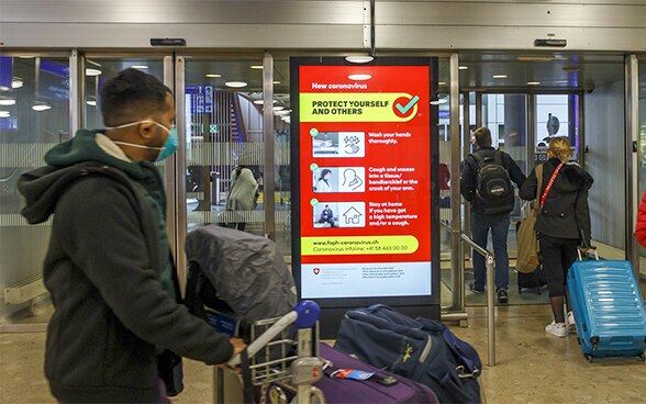 A poster with hygiene rules is pasted in a window to protect against the new coronavirus. 