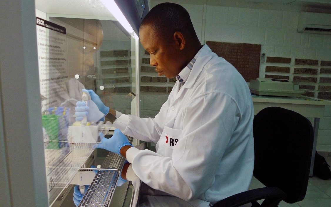  A researcher in a laboratory carries out analysis under a microscope