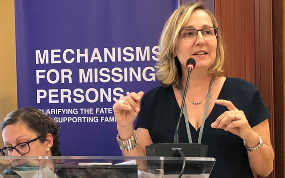 Caroline Douilliez-Sabouba, head of the Missing Persons Project of the International Committee of the Red Cross, at the lectern. 