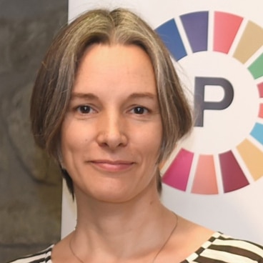 Das Bild zeigt Eva Schmassmann, welche die Koordinationsstelle der Plattform Agenda 2030 führt. 