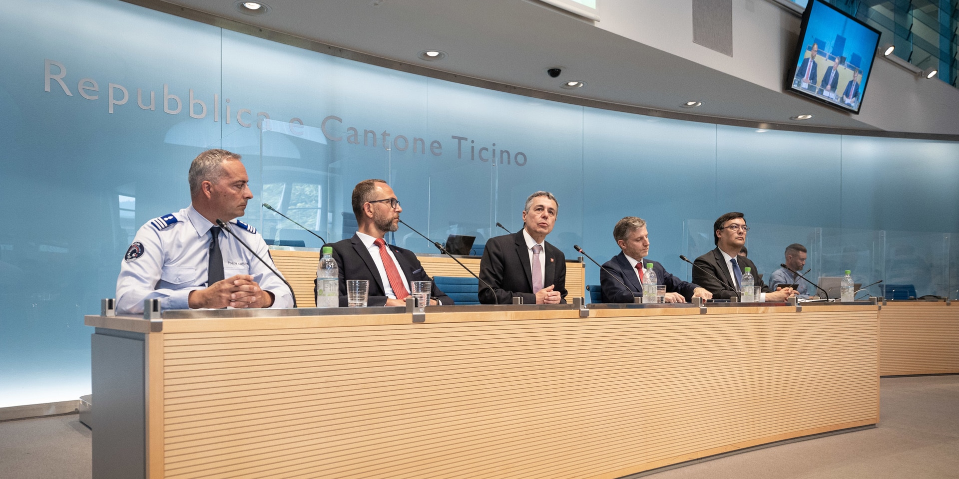 President Ignazio Cassis speaks at the media conference with Ticino State Councillor Norman Gobbi, Simon Pidoux, Special Ambassador for URC2022, Terence Billeter, Head of Task Force and Matteo Cocchi, Commander of the Ticino Police.