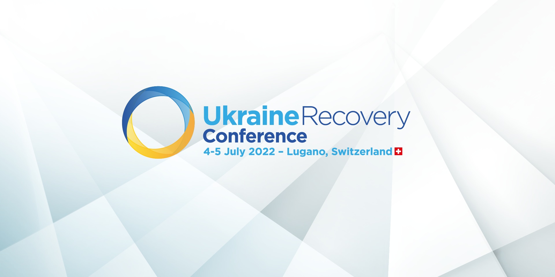 Le logo de l’Ukraine Recovery Conference 2022 comporte un cercle moitié jaune moitié bleu à côté duquel figurent des indications de lieu et de date (en bleu). 