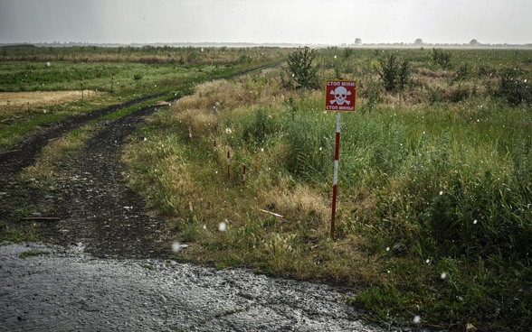 A sign warns of a minefield in Ukraine.