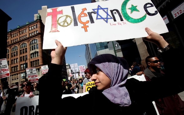 A young protester at a rally in New York in April 2011 demands tolerance for all religions.