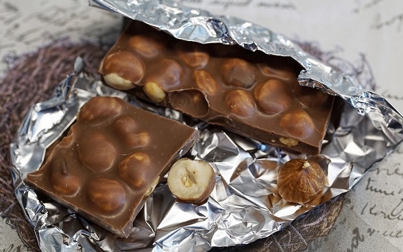 A bar of milk chocolate with hazelnuts.