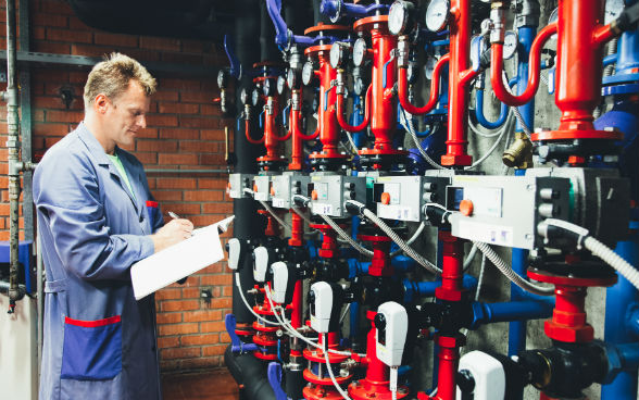 Worker in the heating room of Bled primary school