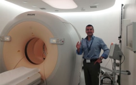 Dr Anthony Samuel Nuclear medicine specialist Head of the radiology department of the Mater Dei Hospital presents a PET scanner.